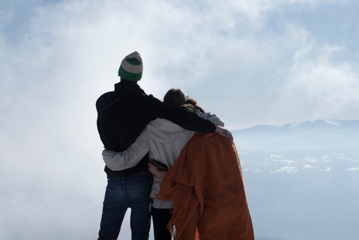 Three Friends Being Together on a Mountain